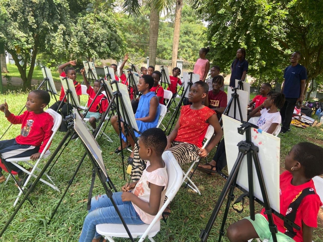 A group of Thrive EDU students at an outdoor painting workshop